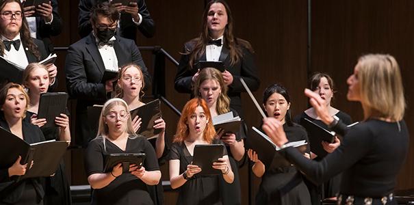 UNC choir members performing on stage